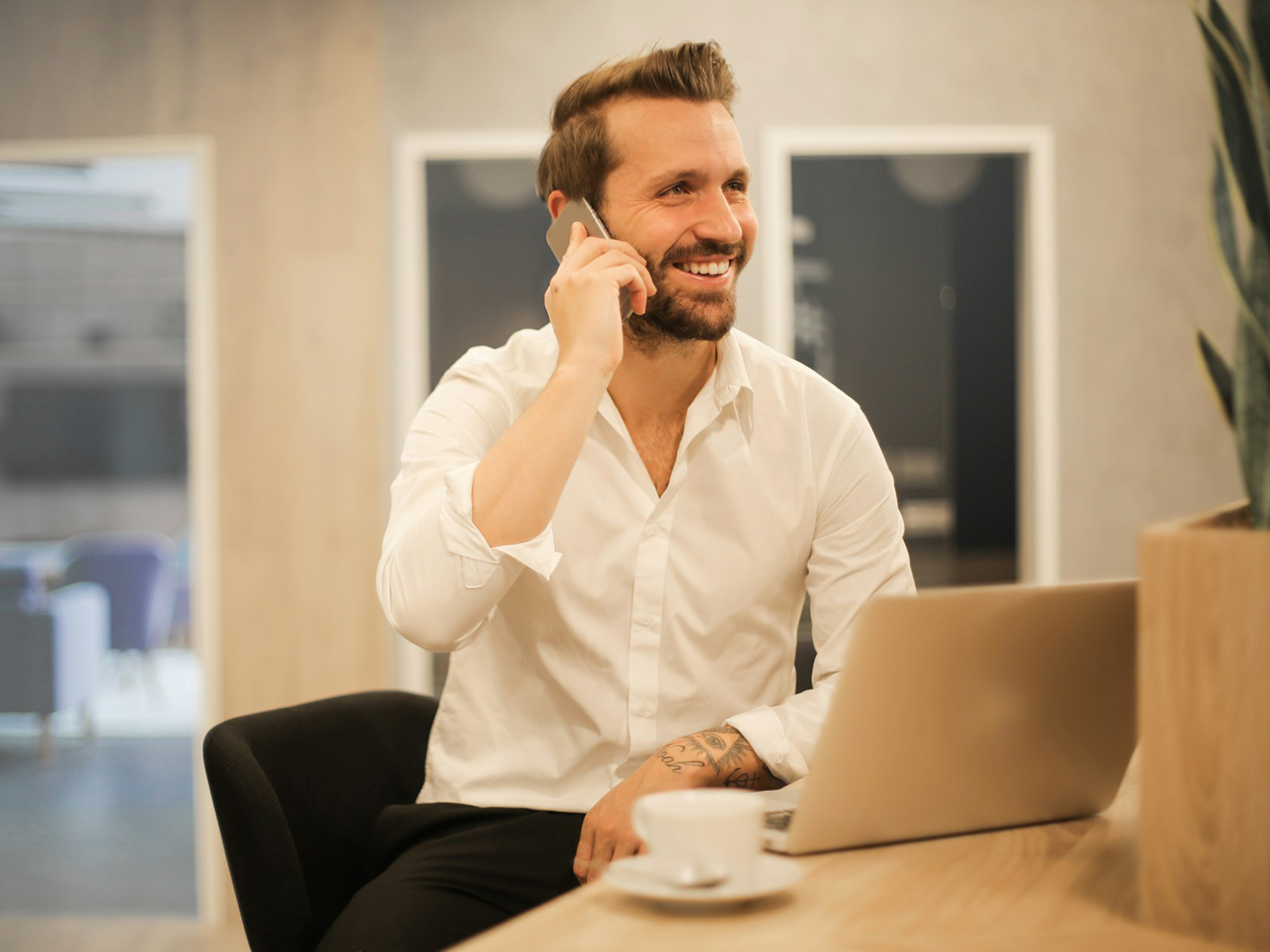 a business man in an office talking on a mobile phone